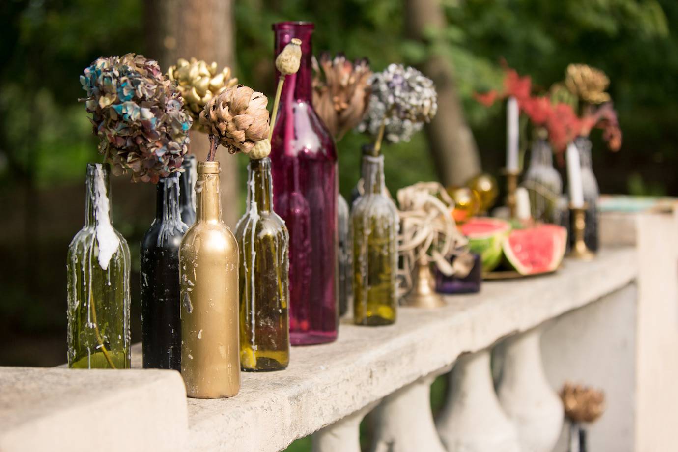 Colorful bottles with dried flowers.