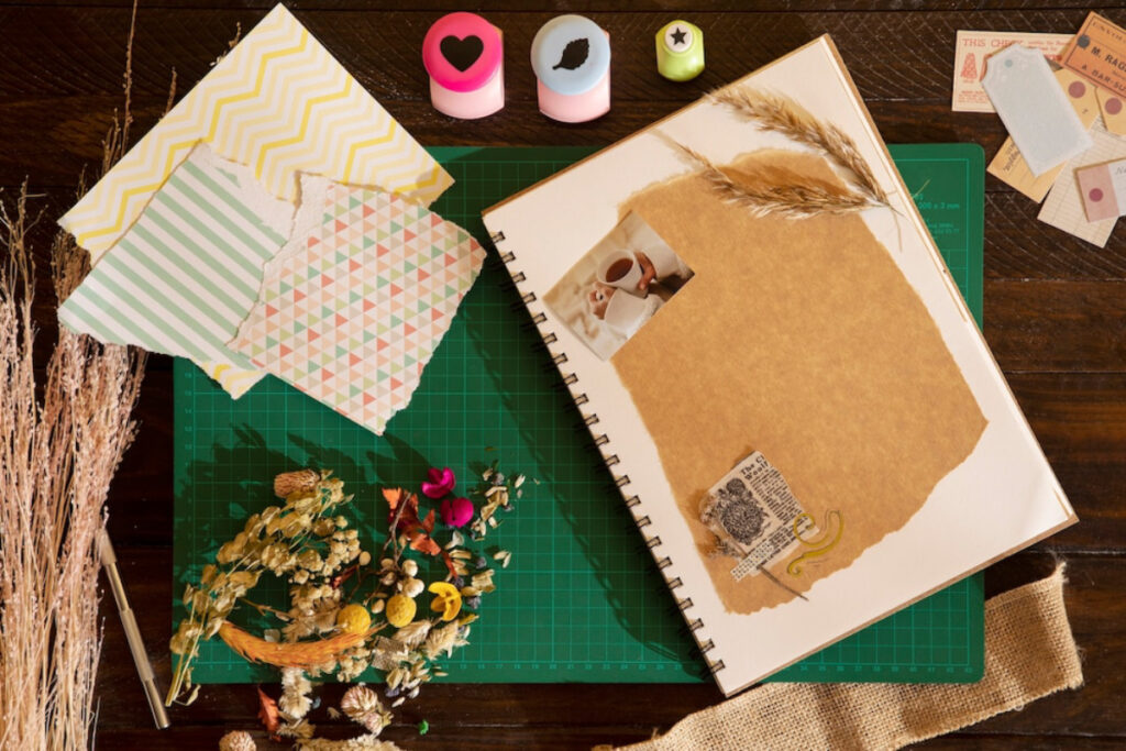 A flat lay of a scrapbook with decorative papers.